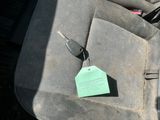 a green tag on the seat of a car