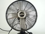 a black fan that is sitting on a white table