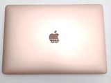 a laptop with an apple logo on the back of it