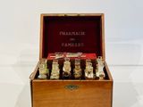 a wooden box filled with small bottles of perfume
