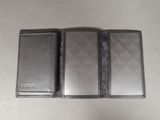 someone is taking a wallet out of a wallet case