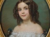 portrait of a young girl in a blue and white dress