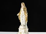 an image of a statue of the virgin mary of guadalupe on a pedestal