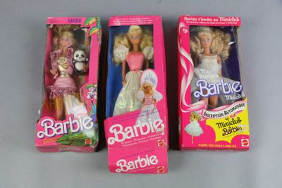 three barbie dolls are sitting in their boxes on a table