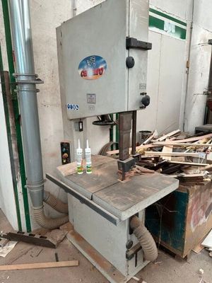 a machine that is sitting in the middle of a pile of wood