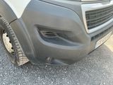 a close up of the front bumper of a van