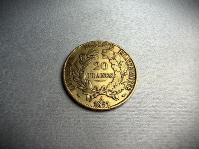 a close up of a gold coin on a table