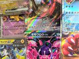 several pokemon cards are displayed on a table in a store