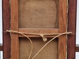 a picture of an old wooden frame with a rope around it