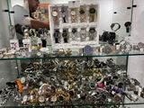 a glass display case filled with lots of watches