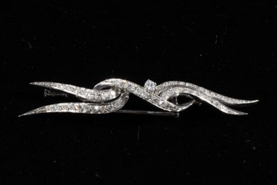 Broche à motif de flamme en or 750/°°° ornée de diamants ron…