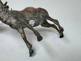 a statue of a horse with a tag on it ' s back