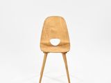 an image of a wooden chair with a hole in the back