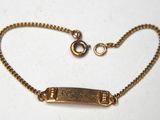 gold plated bracelet with an engraved bar on a ball chain