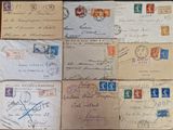 several old envelopes are sitting on a table with stamps on them