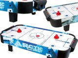 a close up of a table top air hockey game on a white background