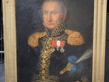 portrait of a man in a military uniform holding a sword