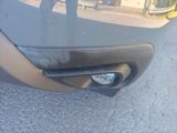 a close up of a car door handle with a reflection of a person in the background