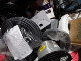 a pile of wires and other electrical equipment on a table