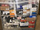 a metal cart with many items in it in a warehouse