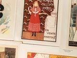 a lot of posters on the wall of a room
