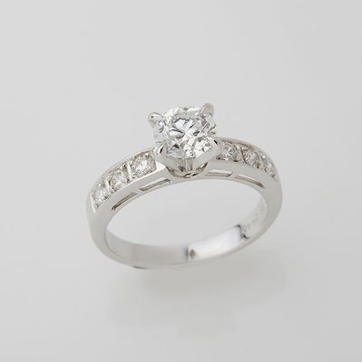 a close up of a diamond ring on a white background