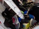 a bag full of shoes and other items in it