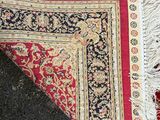 a rug on the floor next to a rug on the floor