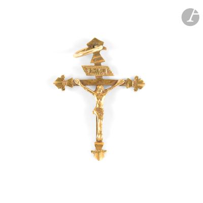 gold plated crucift with a crown on top of it