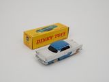 dinky toy car with box on white surface with white background