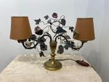 a table with a lamp and a lamp shade on it