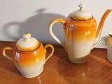 three different types of teapots sitting on a table