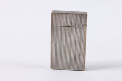 a silver lighter sitting on top of a white surface