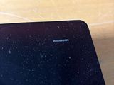 a close up of a cell phone sitting on a table