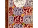 un vieux livre sur lequel figurent une image de fleurs et du texte