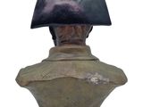 bust of a man wearing a hat with a black top