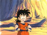 une image représentant le jeune Gohan debout devant une montagne