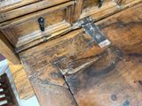 a wooden desk with a drawer on top of it