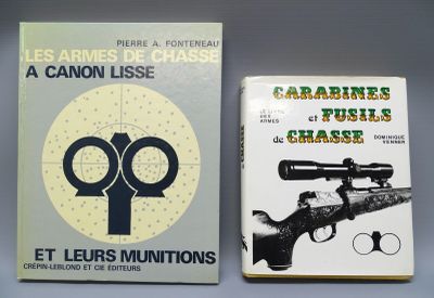 two books on a table one is a gun and the other is a book