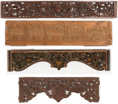 four carved wooden plaques of various sizes and shapes