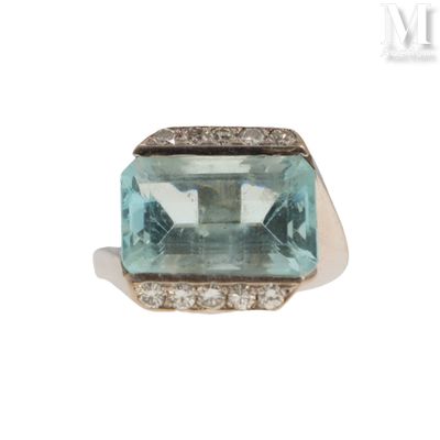an image of an aquamarinee and diamond ring on a white background