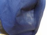 a close up of a blue bag on a table