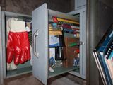 a metal box with a bunch of items inside of it