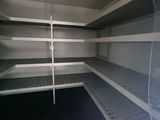 a very long shelf in the middle of a room