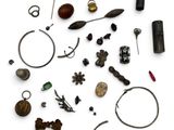 an image of a collection of various metal objects on a white surface
