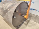 an image of a large metal drum with screws on it