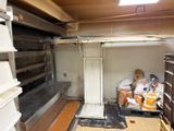 an image of a kitchen with a lot of shelves