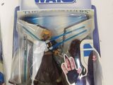 a toy figure of a woman with a sword in a package
