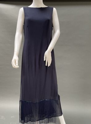 a mannequin wearing a blue dress with black trims