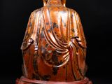an image of a statue of a person sitting on a lotus flower